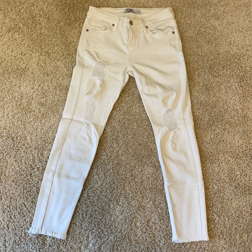 Distressed/ripped white jeans with raw hems